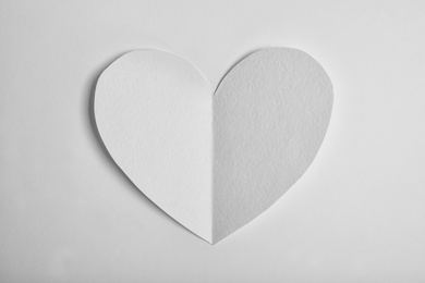 Photo of Paper heart on white background, top view