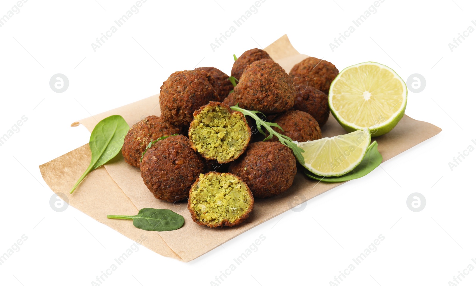 Photo of Delicious falafel balls, basil, arugula and lime isolated on white