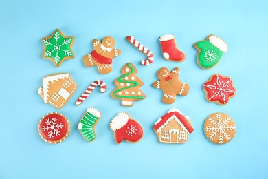 Tasty homemade Christmas cookies on color background, top view