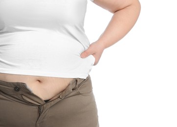 Overweight woman in tight shirt and trousers on white background, closeup