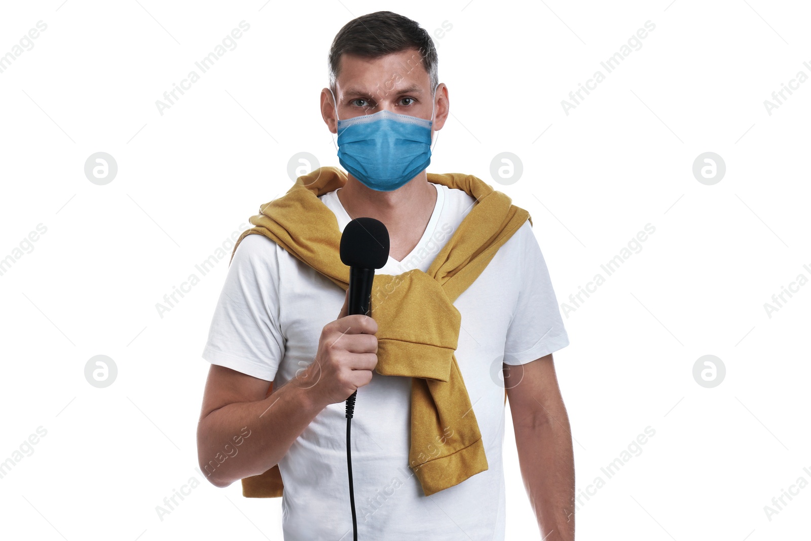 Image of Journalist with microphone wearing medical mask on white background. Virus protection