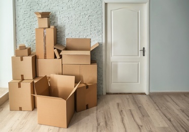 Photo of Cardboard boxes on floor indoors