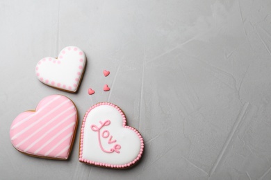 Valentine's day cookies on grey table, flat lay. Space for text