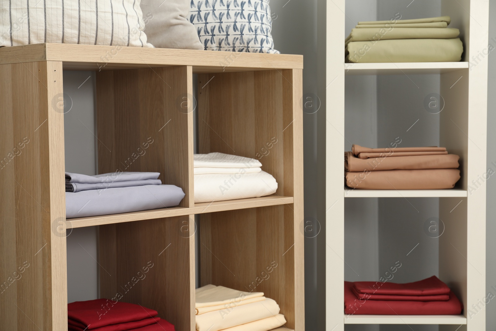 Photo of Different colorful bed linens on display in home textiles store