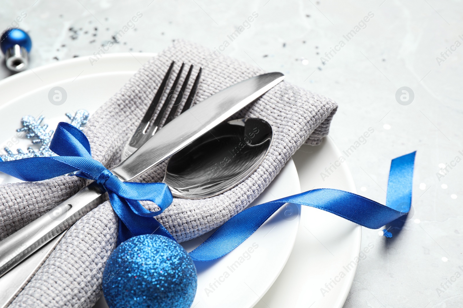 Photo of Beautiful Christmas table setting on grey background, closeup