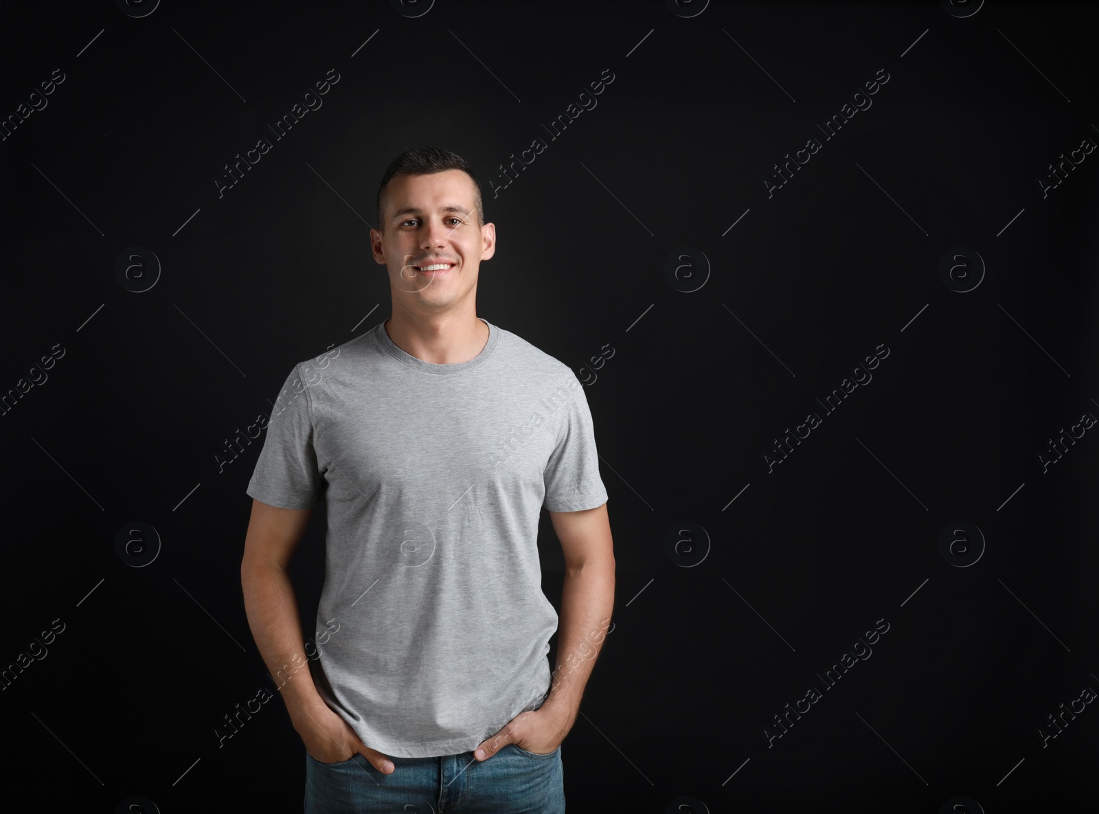 Photo of Portrait of handsome man on black background