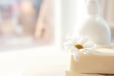 Photo of Flower on pieces of soap for body care, closeup