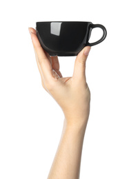 Woman holding black cup on white background, closeup