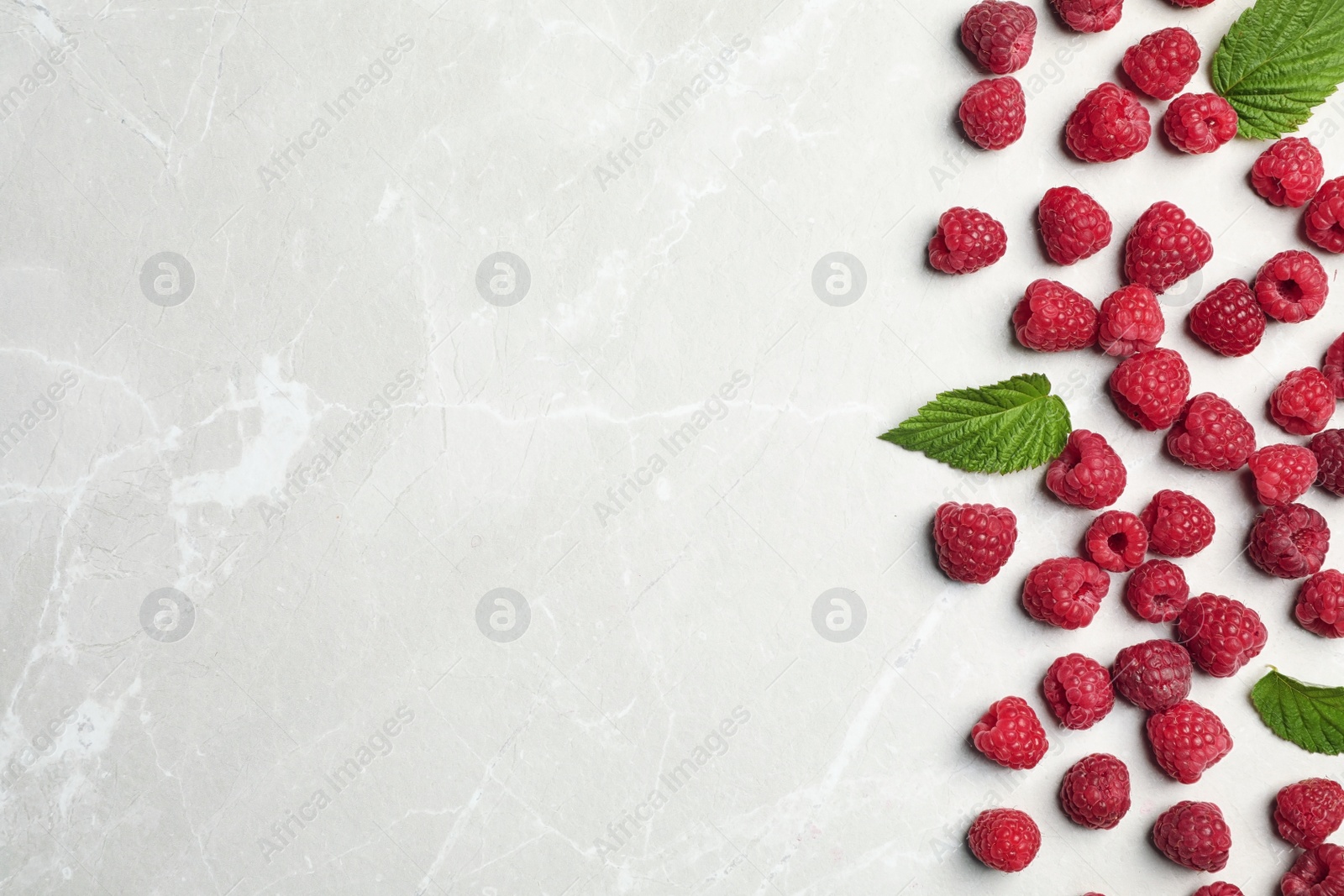 Photo of Ripe aromatic raspberries on table, top view