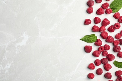 Ripe aromatic raspberries on table, top view