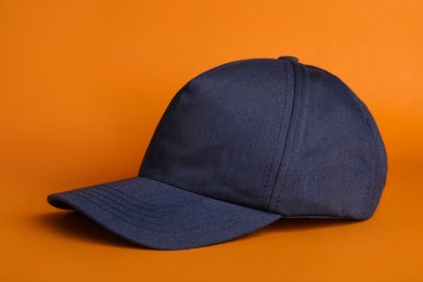 Baseball cap on orange background. Mock up for design
