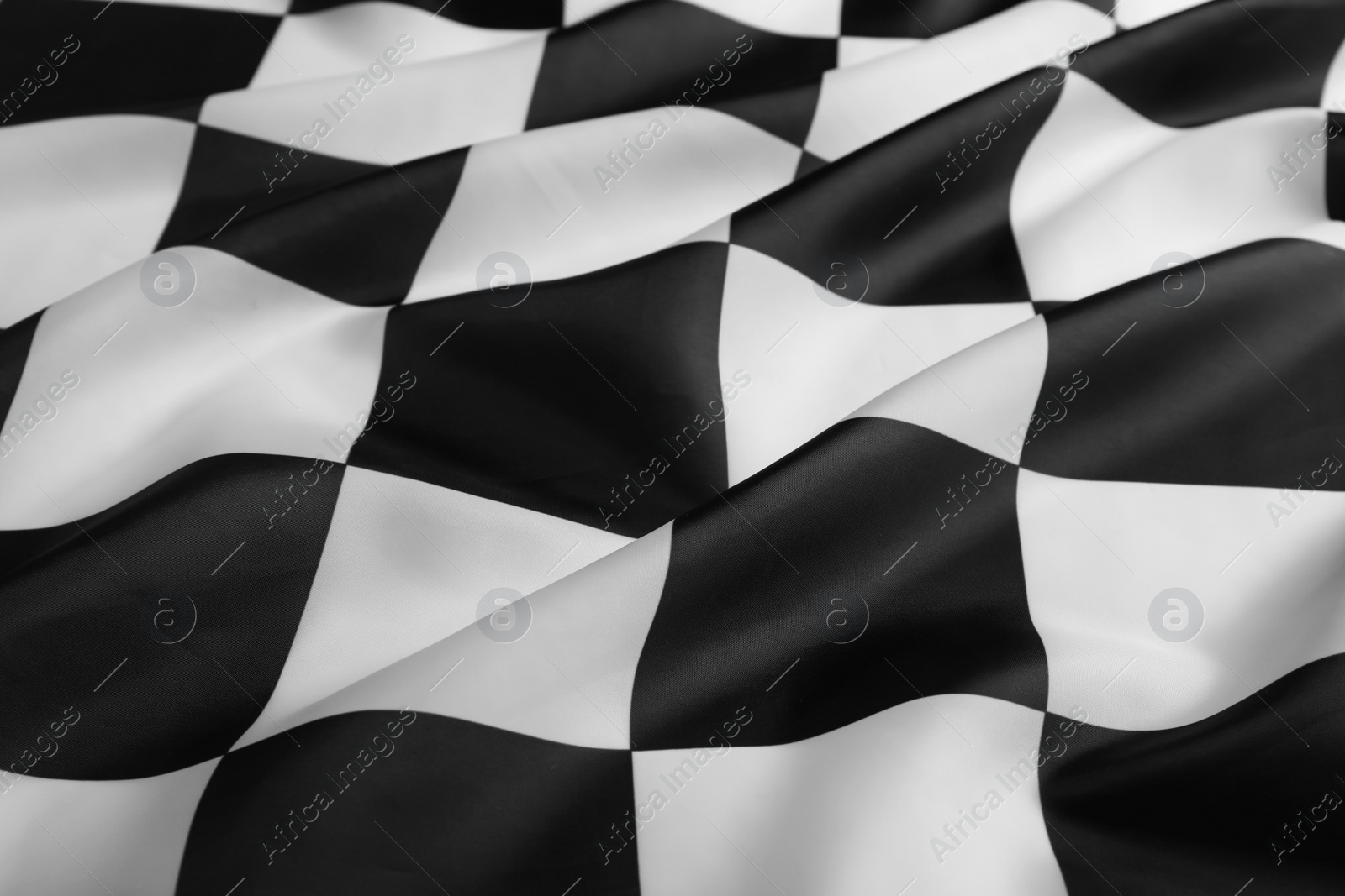 Photo of Checkered finish flag as background, closeup view