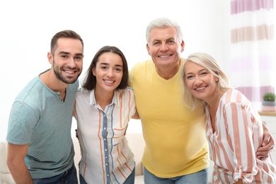 Photo of Portrait of happy family at home. Reunion of generations