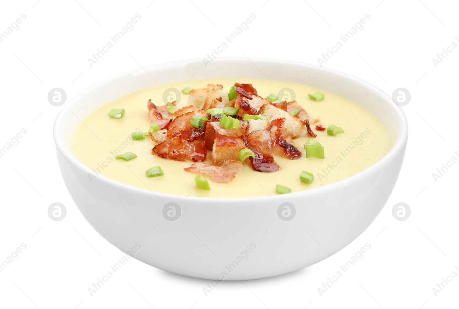 Photo of Tasty potato soup with bacon, croutons and green onion in bowl isolated on white