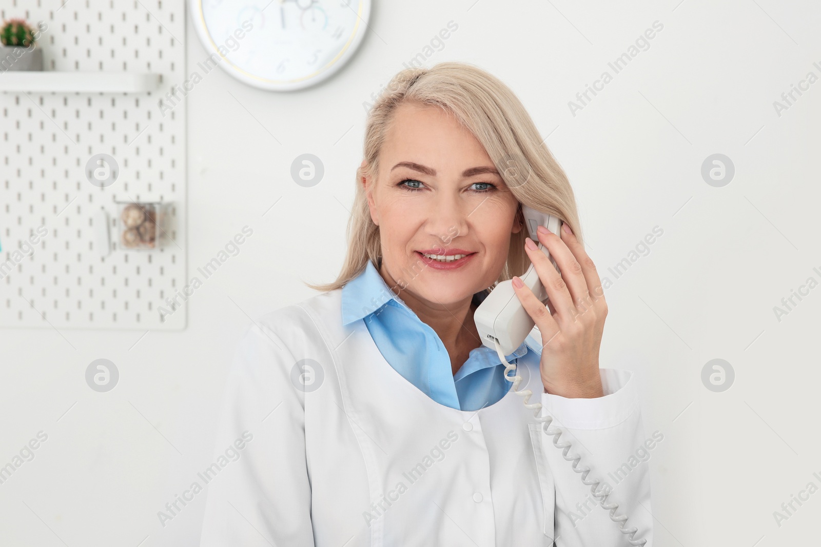 Photo of Senior female receptionist working in hospital