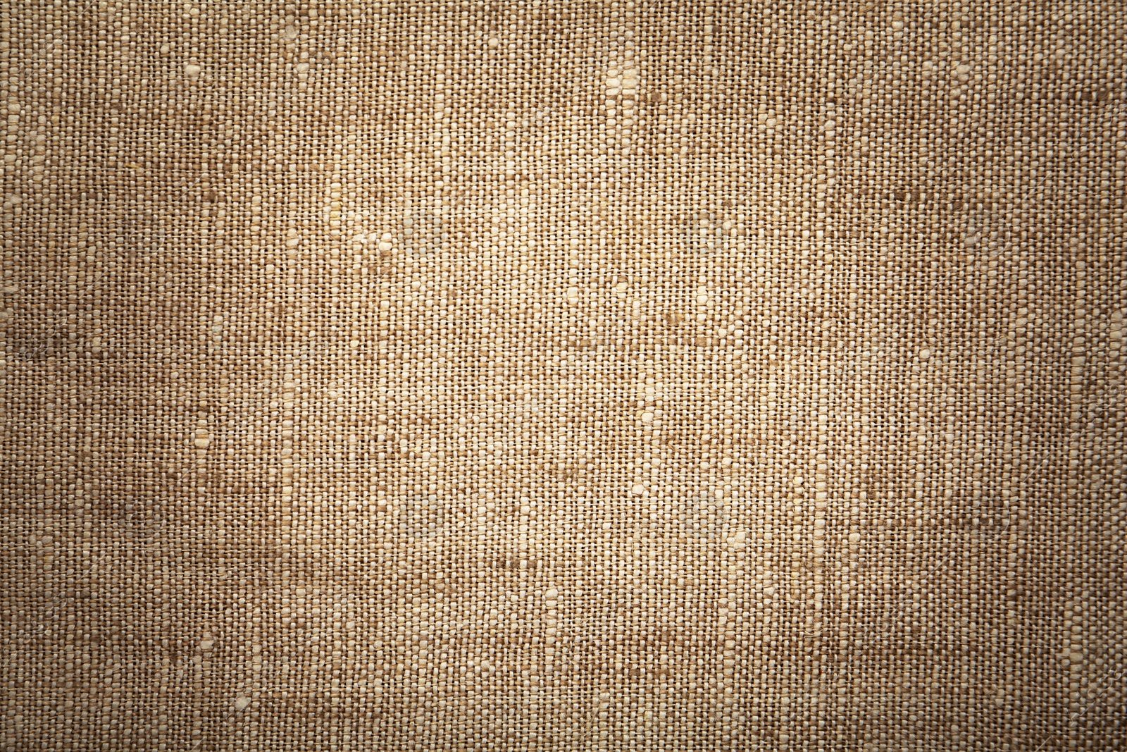 Image of Texture of natural burlap fabric as background, top view. Vignette effect 