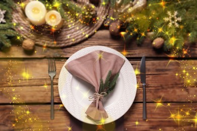 Image of Christmas place setting for festive dinner on wooden table, flat lay. Bokeh effect