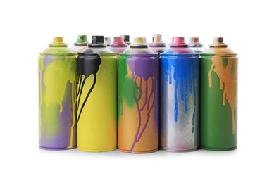 Photo of Used cans of spray paints on white background. Graffiti supplies