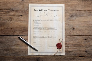 Photo of Last Will and Testament with pen on wooden table, top view