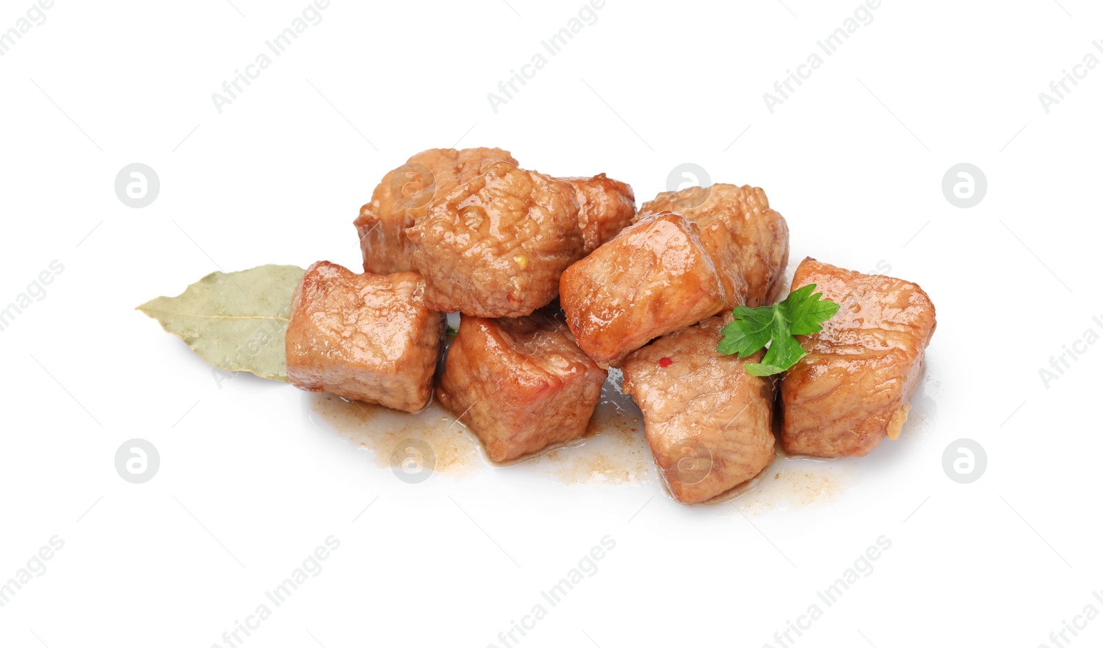 Photo of Pieces of delicious cooked beef, bay leaf and parsley isolated on white. Tasty goulash