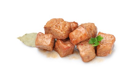 Photo of Pieces of delicious cooked beef, bay leaf and parsley isolated on white. Tasty goulash