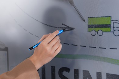 Photo of Business trainer with pen using interactive board, closeup