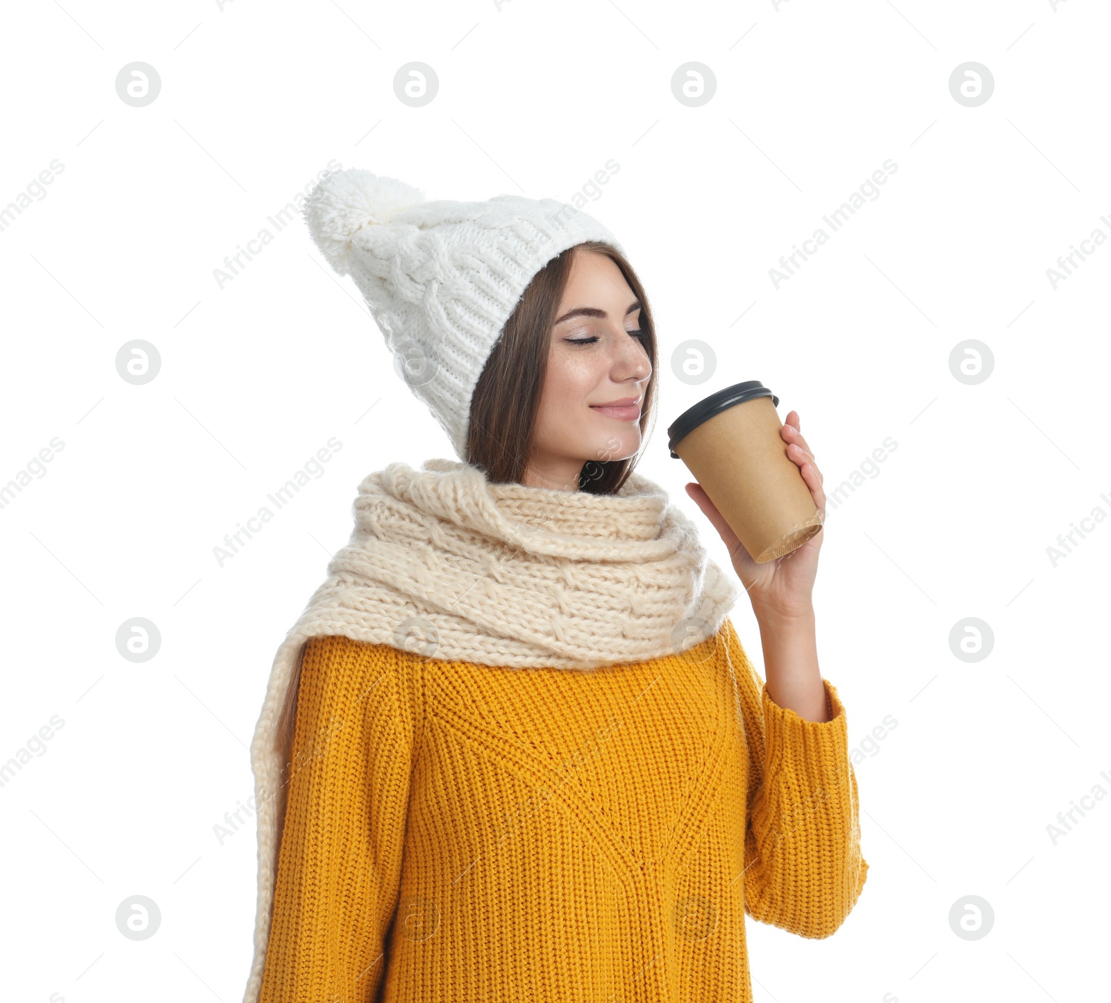 Photo of Happy beautiful woman with paper cup of mulled wine on white background