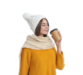 Happy beautiful woman with paper cup of mulled wine on white background