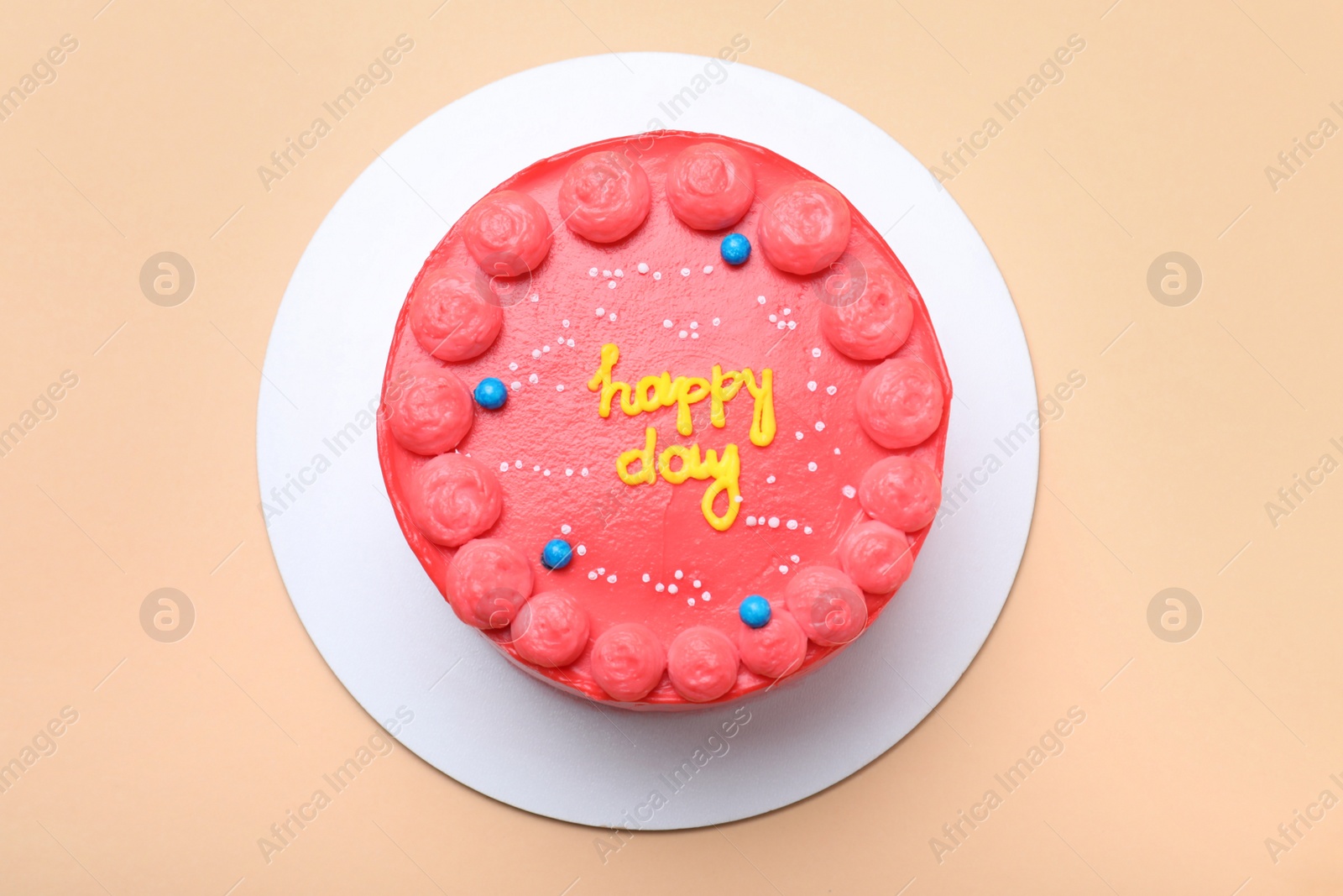 Photo of Cute bento cake with tasty cream on beige background, top view