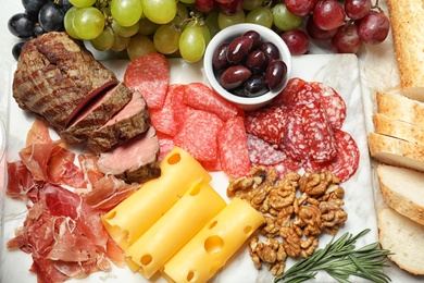 Photo of Flat lay composition with snacks for wine on white background