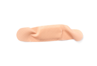 Photo of Used sticking plaster isolated on white, top view. First aid item