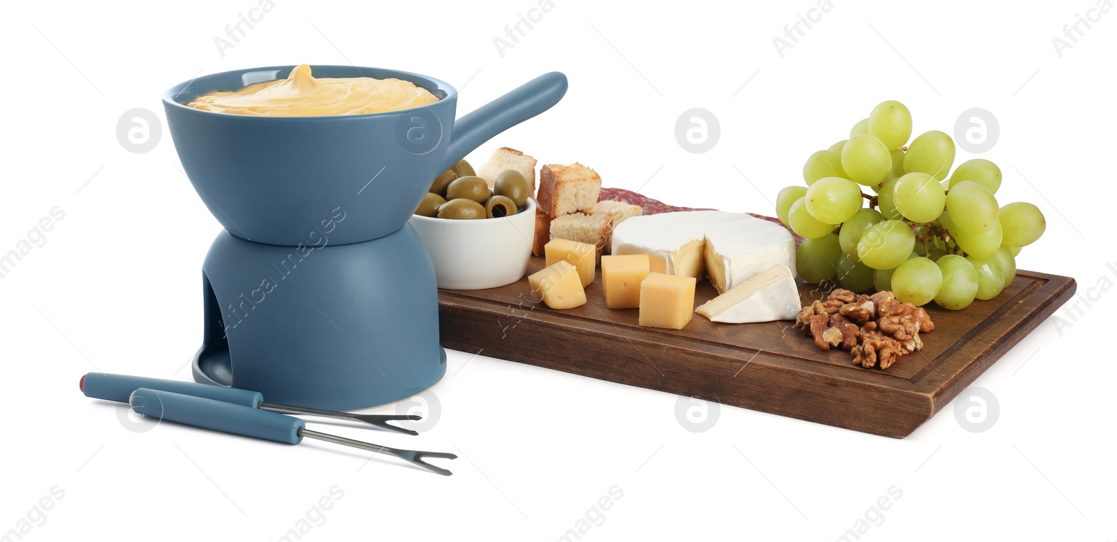 Photo of Fondue with tasty melted cheese, forks and different snacks isolated on white