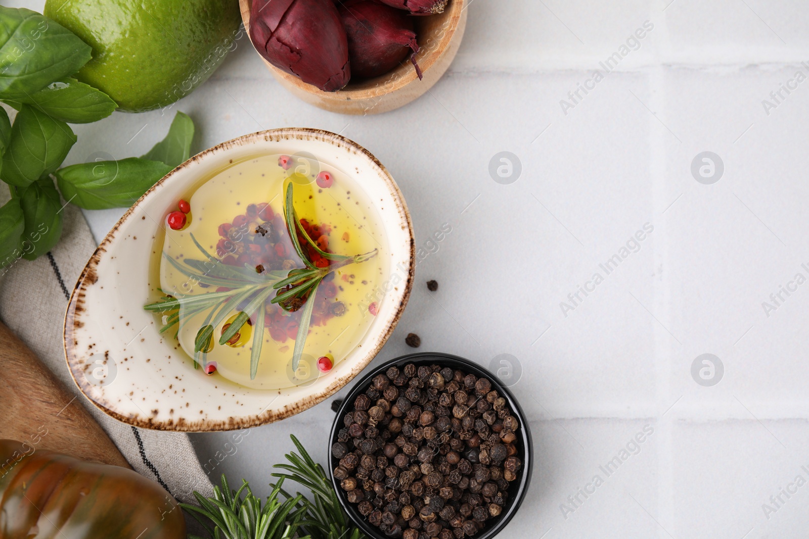 Photo of Tasty marinade and products on light tiled table, flat lay. Space for text