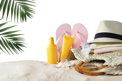 Photo of Composition with beach objects on sand against white background. Space for text