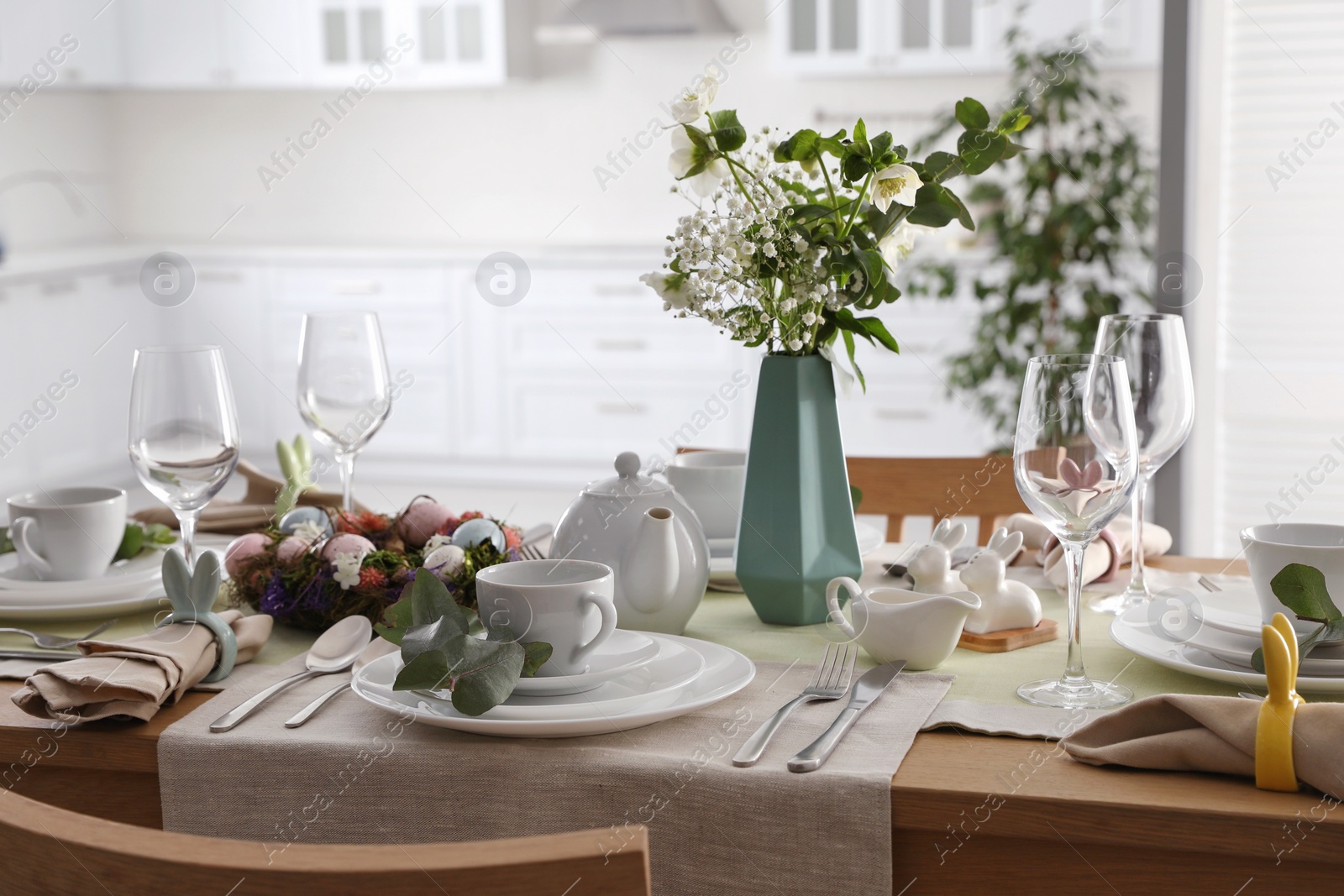 Photo of Beautiful Easter table setting with festive decor indoors