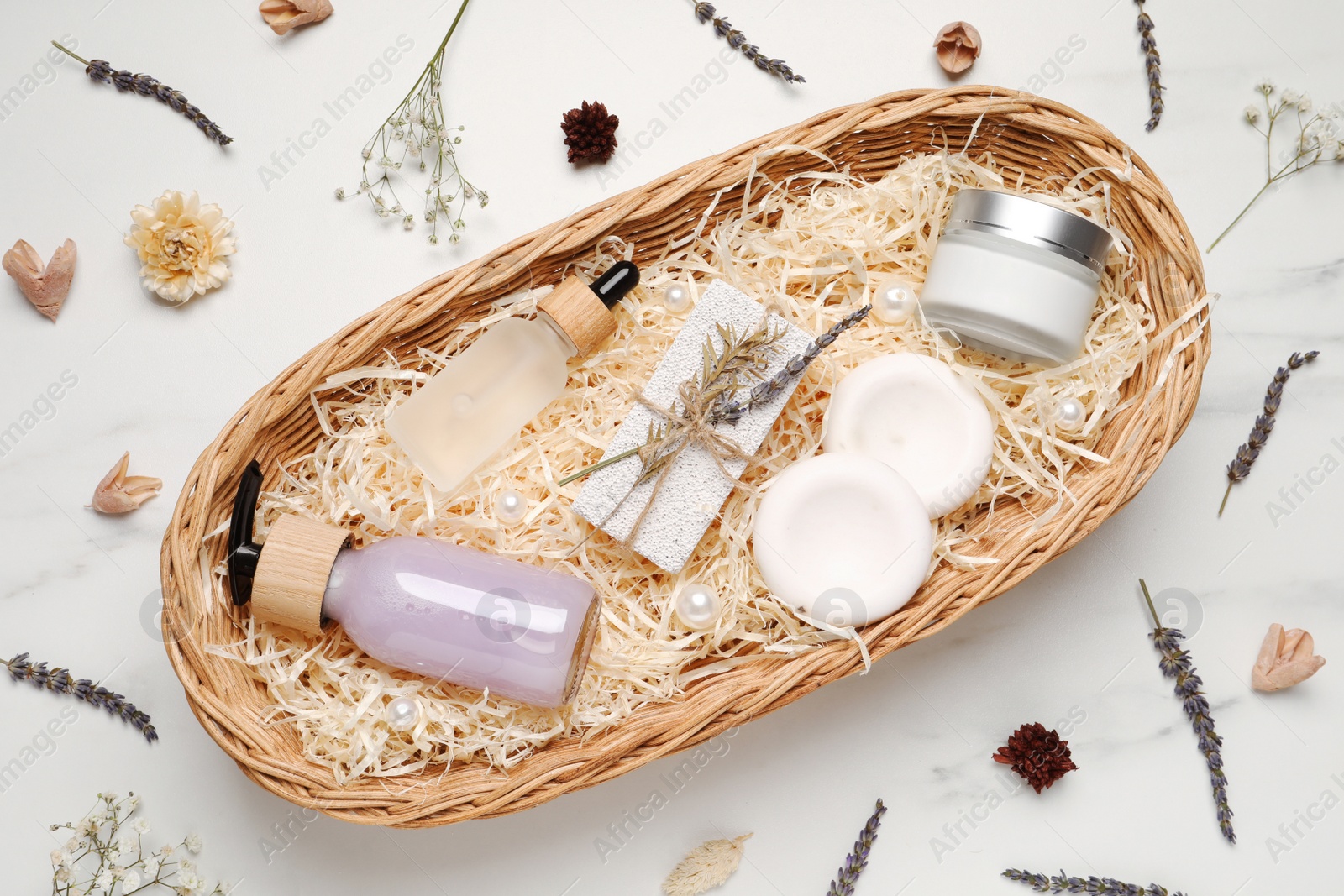 Photo of Spa gift set with different personal care products on white marble table, flat lay