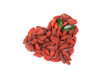 Heart shaped pile of dried goji berries with leaves on white background, top view