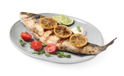 Photo of Plate with delicious roasted sea bass fish and garnish on white background