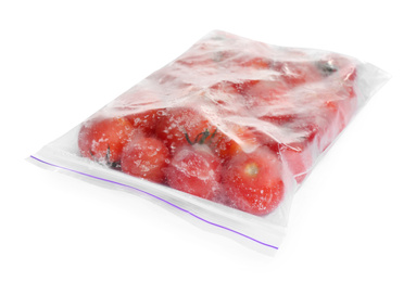 Photo of Frozen tomatoes in plastic bag isolated on white. Vegetable preservation