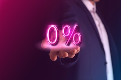 Image of Man holding virtual sign of Zero Percent on color background, closeup. Special promotion