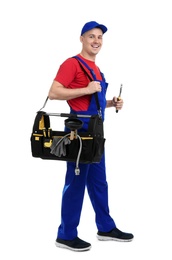 Photo of Young plumber with tool bag on white background