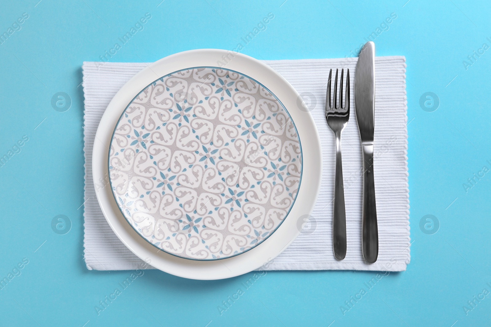 Photo of Stylish elegant table setting on color background, top view