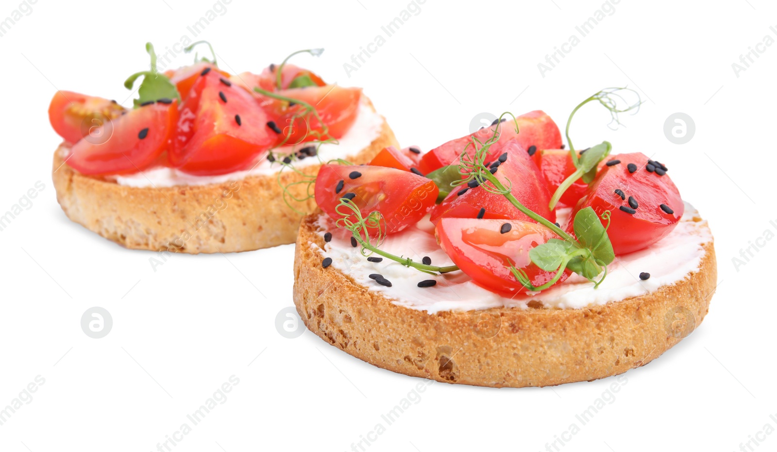 Photo of Tasty rusks with cream cheese, fresh tomatoes and black sesame seeds isolated on white