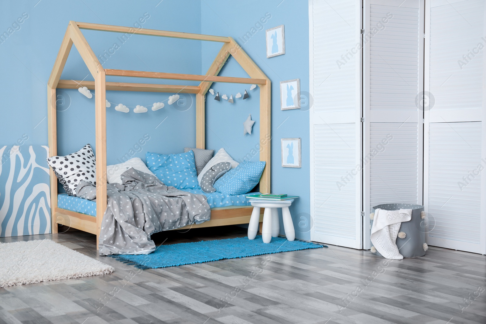 Photo of Comfortable bed in modern children room