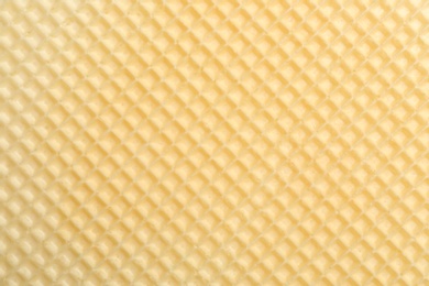 Photo of Tasty wafer as background, closeup. Crispy food