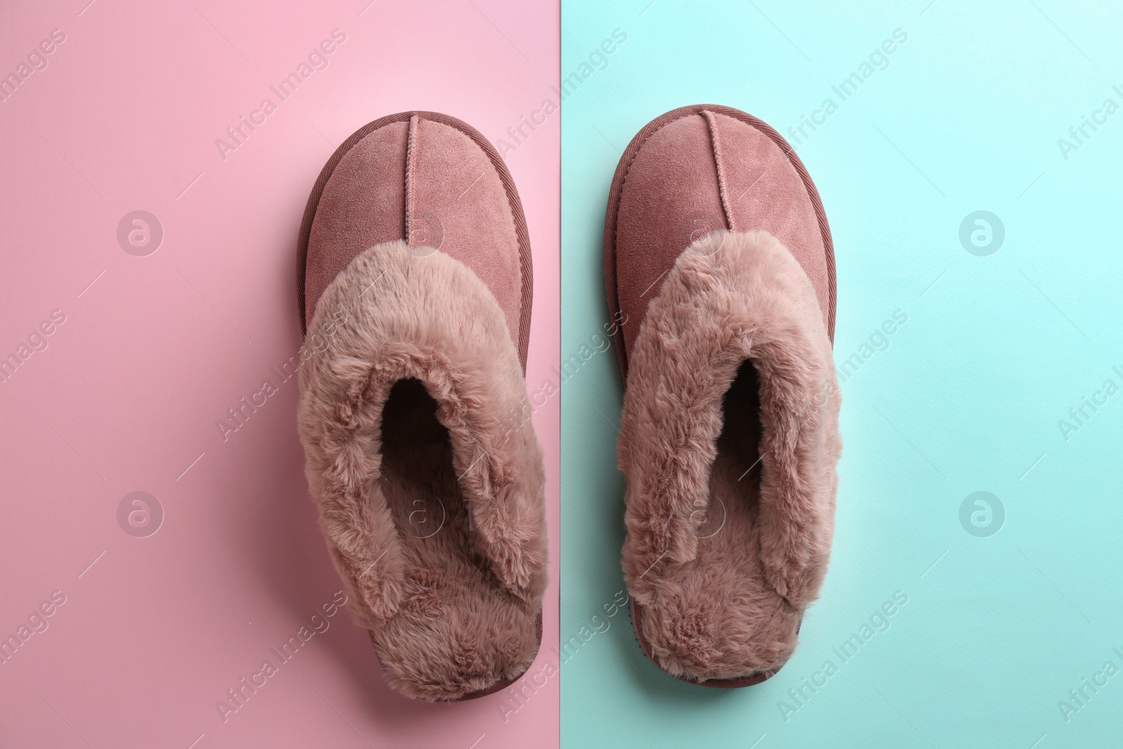 Photo of Pair of stylish soft slippers on color background, flat lay