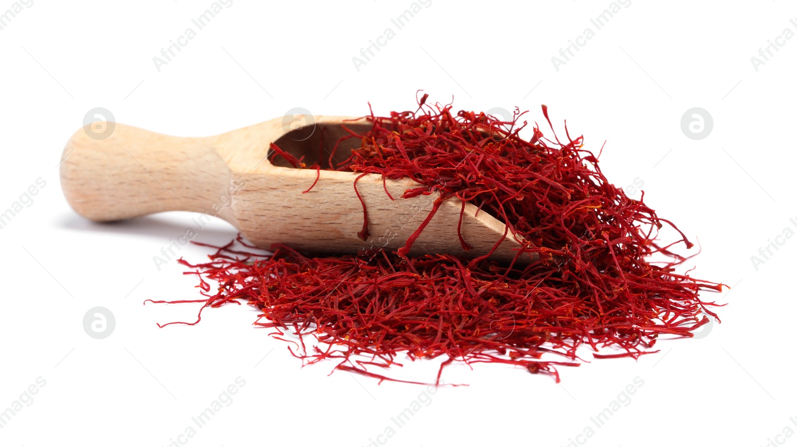 Photo of Aromatic saffron and scoop isolated on white