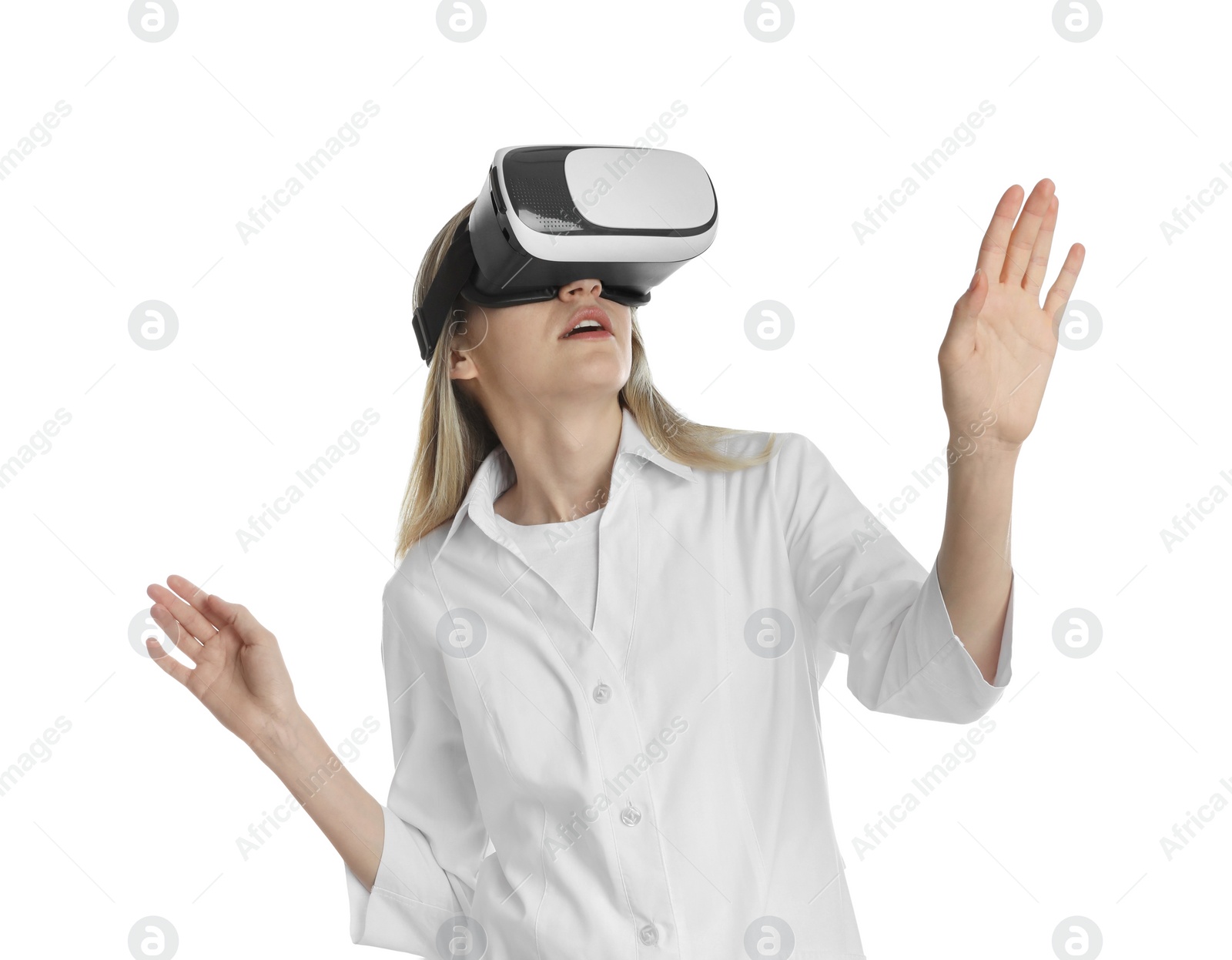 Photo of Young woman using virtual reality headset on white background