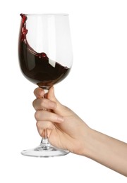 Photo of Woman with red wine splashing out of glass on white background, closeup