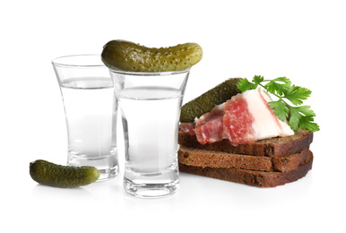 Photo of Russian vodka and different appetizers isolated on white